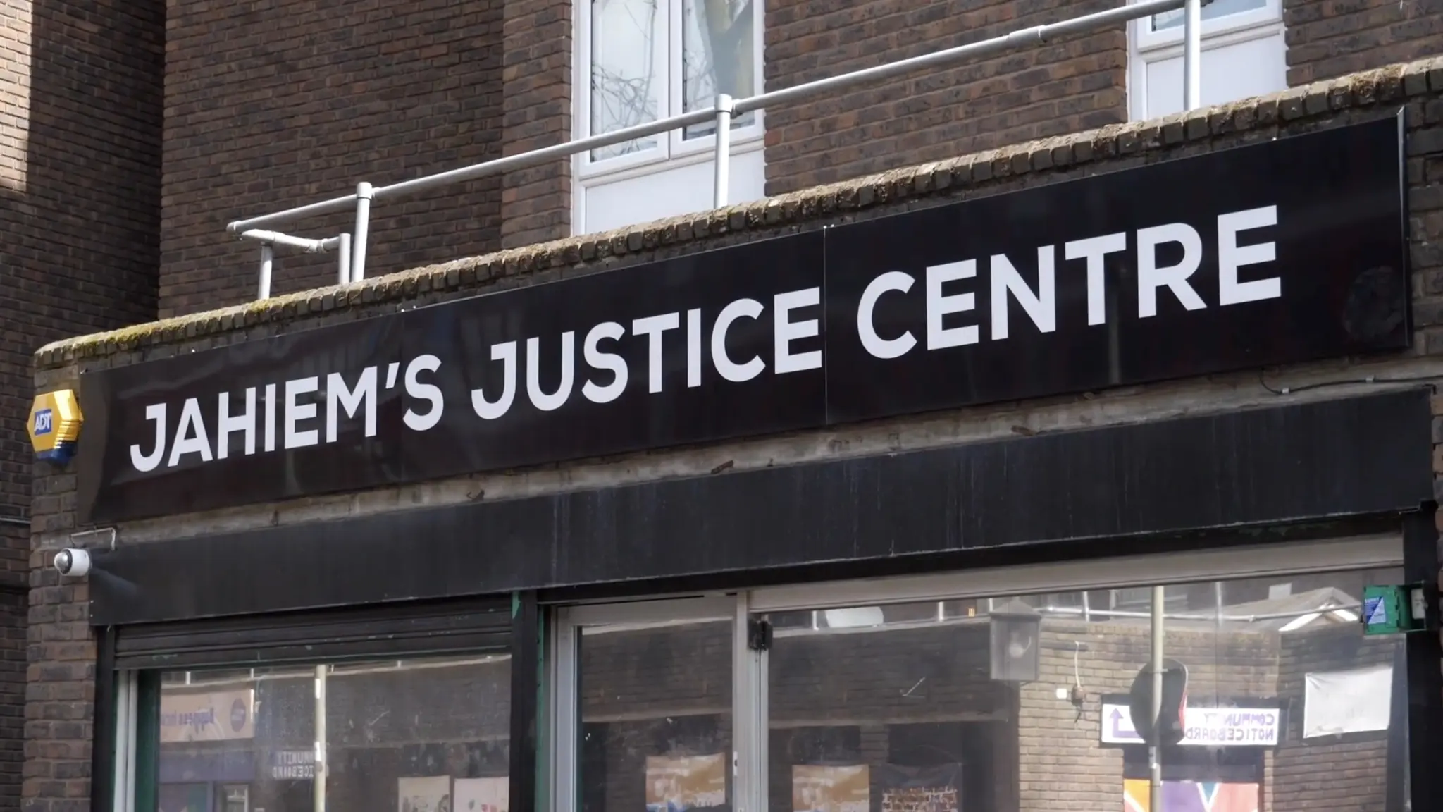 A screenshot of the Member Stories video from Youtube that shows the front display of the Jahiem's Justice Centre.